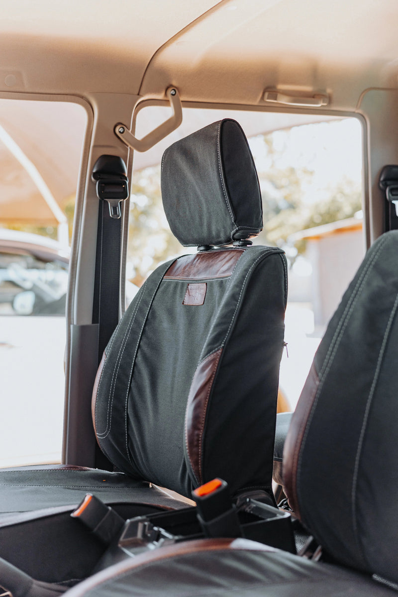 Beesdam black diamond-stitch leather seat covers fitted in a vehicle