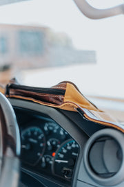 Beesdam custom-fit dash cover fitted over a vehicle dashboard