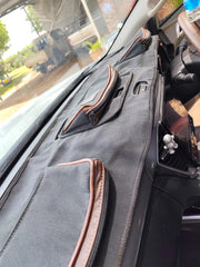 Beesdam African range dash cover in grey fabric with brown leather trim pockets fitted in a Toyota bakkie