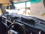 Beesdam Deluxe dash cover in all-black fabric fitted in a Toyota Land Cruiser