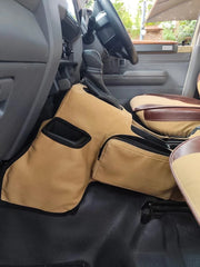 Beesdam Deluxe tan canvas transmission tunnel cover with phone pocket and zip pouch fitted in a Toyota Land Cruiser 79