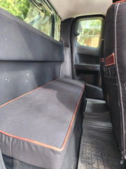 Beesdam Legacy Plus rear bench seat cover fitted in a double-cab bakkie with contrast trim