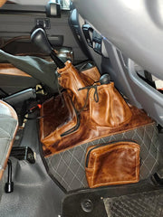 Beesdam premium transmission and console cover with tan leather pockets fitted in a bakkie